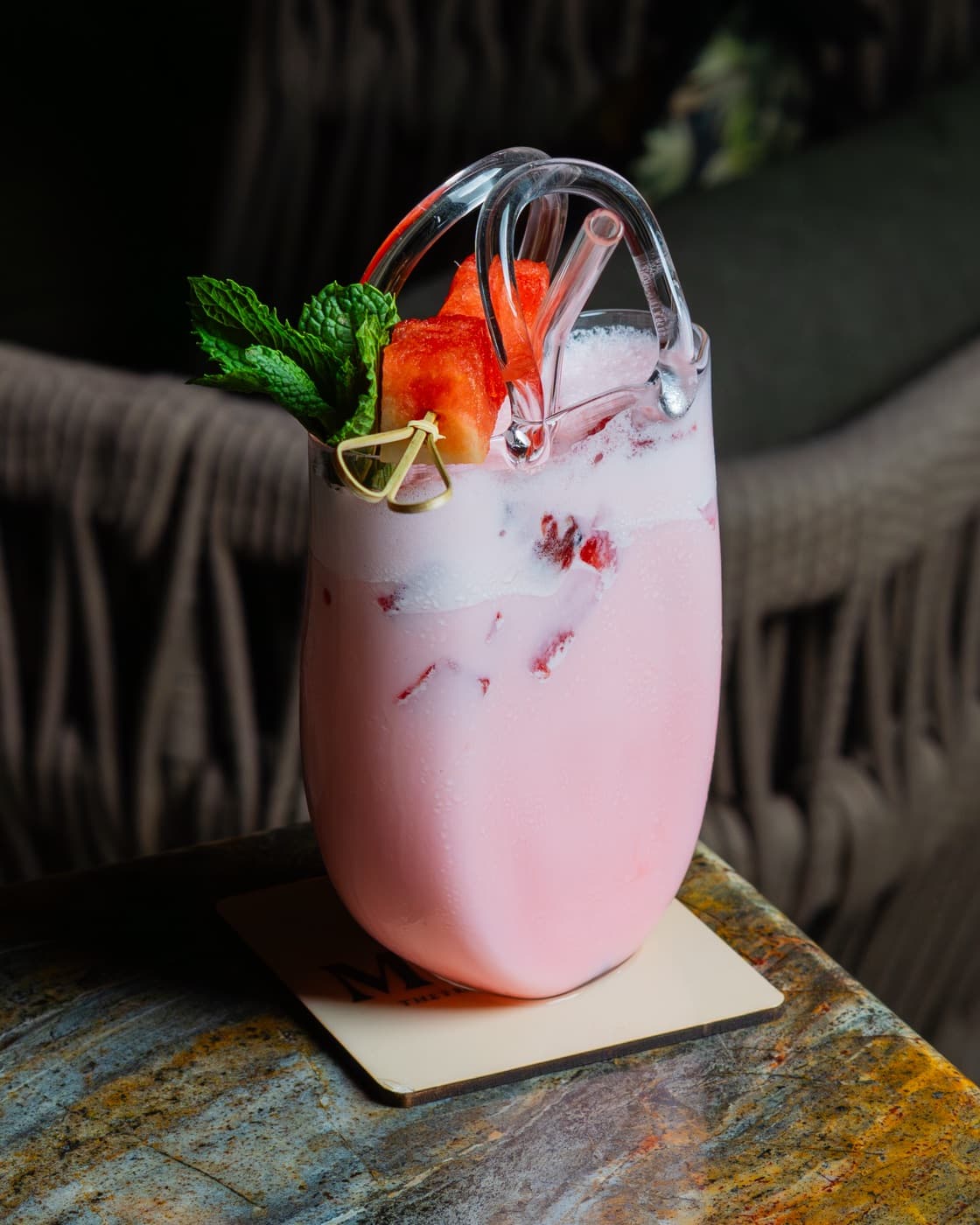 Blush-pink cooler garnished with watermelon